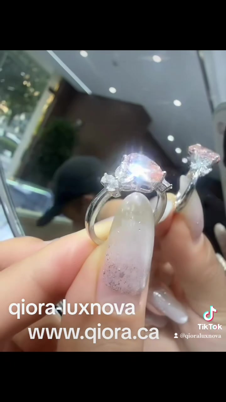 2.00ct pink pear lab-grown diamond ring held at the source store